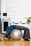Woman using Exercise Ball in Office
