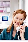 Businesswoman Using Telephone