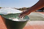 Athlete Reaching for Chalk in Bowl