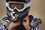 Boy Taking off Helmet