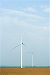 Wind turbines in plowed field