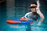 a swimming man wearing a pair of goggles