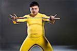 a man practicing nunchakus