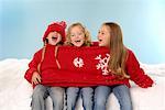 Three Girls Wearing One Sweater