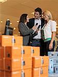 Couple Buying Telephone from Saleswoman