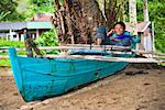 Fisherman with Cellular Phone, Bungus Bay, Sumatra, Indonesia