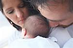 Portrait of Parents With Newborn Baby