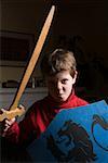Boy with toy sword and shield