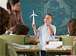 Boy holding wind turbine