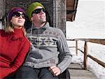 Couple listening to music at chalet