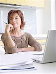 Senior woman running business from home