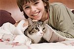 Young boy with pet cat