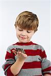 Portrait of Boy Holding Frog