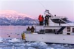 Eco-tourists on Boat Taking Pictures of Eagles, Nemuro Channel, Shiretoko National Park, Hokkaido, Japan