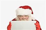 Santa Claus Using Laptop Computer