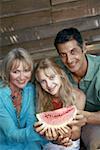 Parents with daughter and watermelon