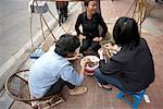 People Eating by Street Vendor, Hanoi, Vietnam