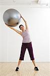 Woman Exercising with Exercise Ball