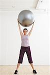 Woman Exercising with Exercise Ball