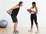 Man Exercising with Personal Trainer