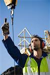 A harbour worker pointing