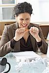 Businesswoman Sitting at Desk Writing