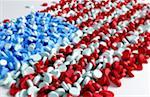 Multiple pills forming the flag of the USA