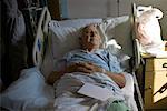 Man Lying in Hospital Bed