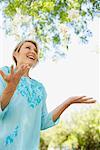 Woman Throwing Flowers into Air