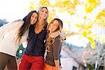 Portrait of Three Women with Arms Around Each Other