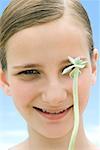 Girl with long stemmed succulent plant