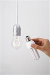 Replacing Incandescent Lightbulb With Energy Efficient Lightbulb