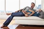 Couple on Sofa in Condominium