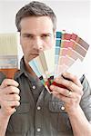 Man with Color Swatches and Paint Brush