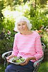 A senior woman eating a healthy salad