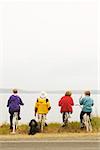 Four women on stationary bikes