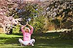 An older woman in a yoga position