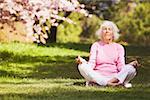 Senior woman in a yoga position