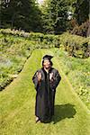 Graduation day for woman in cap and gown