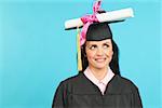 Woman in cap and gown with diploma