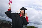 Female graduate holding her diploma