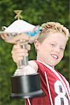 Boy holding a trophy