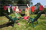 Woman hanging oversized underwear on a clothesline. - Stock Photo -  Masterfile - Premium Royalty-Free, Code: 673-02138553