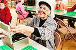 Woman taking money from bingo players