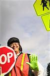 A female crossing guard at work