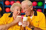 Bowling couple enjoying beverages