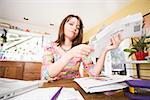 Woman looking at bills in mail