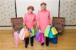 Senior women holding many shopping bags