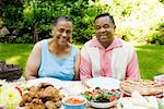 Couple sitting at a summer picnic