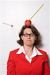 Shooting an apple off businesswoman's head